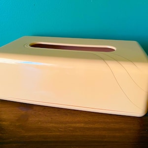 May include: A set of three ceramic mugs with a speckled, matte finish. The mugs are in shades of cream, light gray, and dark gray. Each mug has a simple, minimalist design, perfect for coffee or tea.