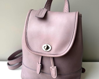 coach backpack small mini Court Colorblock Leather Bag Red Pink Orange Luxe Fashion Finds Refined pebble leather Inside zip cell phone and multifunction pockets Laptop compartment with zip closure Zip closure recycled polyester lining Top handle with 2 drop Outside zip pockets Adjustable shoulder straps Fits a 12 (zip compartment) or 13 (main compartment) laptop 10 3/4 (L) x 14 (H) x 5 1/4 (W) Style No. Vintage Coach Mini Backpack Brown