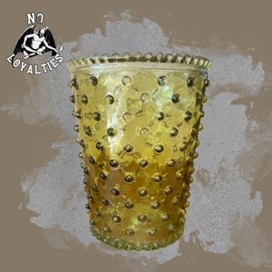 May include: A yellow glass vase with a textured, bumpy surface. The vase has a round, wide mouth and a slightly flared base.