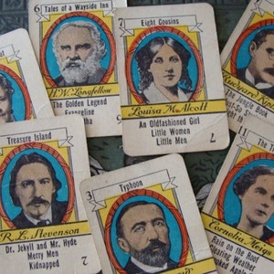 May include: A vintage game card set featuring illustrations of authors and their famous works. The cards are yellow with red and blue accents. The authors include Louisa May Alcott, H.W. Longfellow, R.L. Stevenson, Rudyard Kipling, and Cornelia Meigs.
