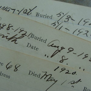 May include: A close-up of a handwritten document with dates and numbers. The document appears to be a record of death and burial dates. The text includes the dates "Aug 8-192", "Aug 9-1921", "May 1/st", "5/8-1926", and "5/1-1926".