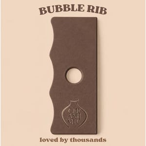 May include: A brown rectangular pottery rib tool with a wavy edge and a circular centre hole. The tool features the text BUBBLE RIB at the top and CER ANH MIC inside a vase-shaped logo at the bottom, with the text loved by thousands of potters worldwide!