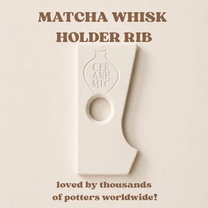 May include: A white ceramic pottery rib tool featuring a cutout circle and an embossed vase-shaped logo with the text CER ANH MIC. The text MATCHA WHISK HOLDER RIB and loved by thousands of potters worldwide! are printed in brown above and below the tool.