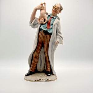 Vintage Pucci Capodimonte Porcelain Doctor Figurine delivering a baby