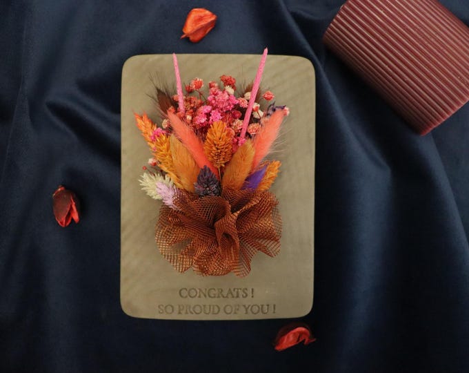Timeless floral beauty in ceramic – a unique dried and artificial arrangement designed to mark life’s milestones and meaningful achievements