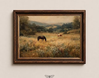 Puede incluir: Un cuadro de paisaje enmarcado que muestra un caballo oscuro y uno claro pastando en un prado dorado con flores silvestres, colinas y árboles al fondo. El texto MOTH & MARGINS con un icono de polilla está centrado debajo del marco.
