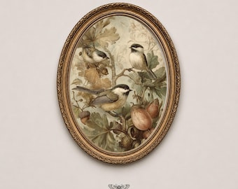 May include: An oval-shaped gold frame containing a print of three small birds perched on branches among oak leaves and acorns. Below the frame, the text reads MOTH & MARGINS with a small moth icon centered between the two words in black ink.
