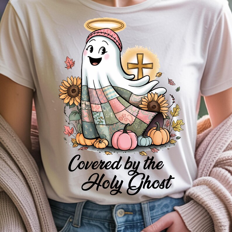A white t-shirt with a cozy and uplifting holy ghost design, accented by soft autumn hues and a heartfelt message. Clean and crisp, the design shines with warmth and clarity on light fabric — perfect for subtle, faith-filled looks.