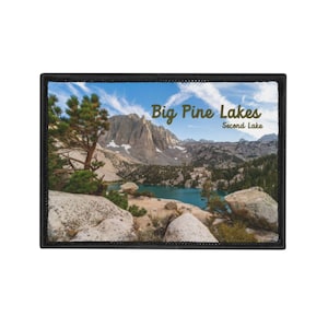 May include: A rectangular patch featuring a scenic landscape of Big Pine Lakes, with a turquoise lake, rocky terrain, and towering mountains under a blue sky. The text "Big Pine Lakes Second Lake" is displayed.
