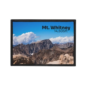 May include: Rectangular patch featuring a scenic view of Mt. Whitney under a blue sky with fluffy white clouds. The text "Mt. Whitney 14,505ft" is printed in black. The patch has a black border.