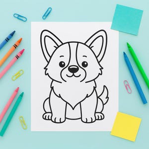 May include: A black and white cartoon illustration of a Corgi dog on white paper. The drawing is surrounded by colorful crayons, paper clips, and sticky notes on a light blue surface.