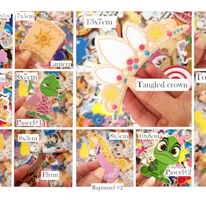 May include: A collection of colorful stickers featuring characters and elements from the movie Tangled. Includes a wanted poster, a lantern, a crown, a sun, a tower, and characters like Rapunzel and Flynn. Sizes vary, with the largest being 13cm x 7cm.