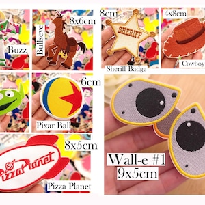 May include: A collection of embroidered patches featuring characters and icons from animated films, including Rex, Woody, Buzz, Bullseye, Forkey, Wall-e, and Eva. Each patch is labeled with its name and dimensions in cm, such as 8x4cm, 9x10cm, and 9x5cm.