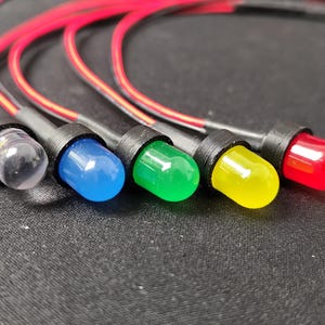 May include: A rustic wooden sign with the text "Welcome to our home" in a handwritten style. The sign features a distressed finish and a simple, inviting design, perfect for entryway decor.