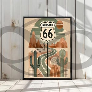 May include: A retro-style illustration of Route 66, featuring a desert landscape with cacti, a winding road, and a classic "Interstate 66" sign. The colors are muted and earthy, with shades of brown, green, and orange.