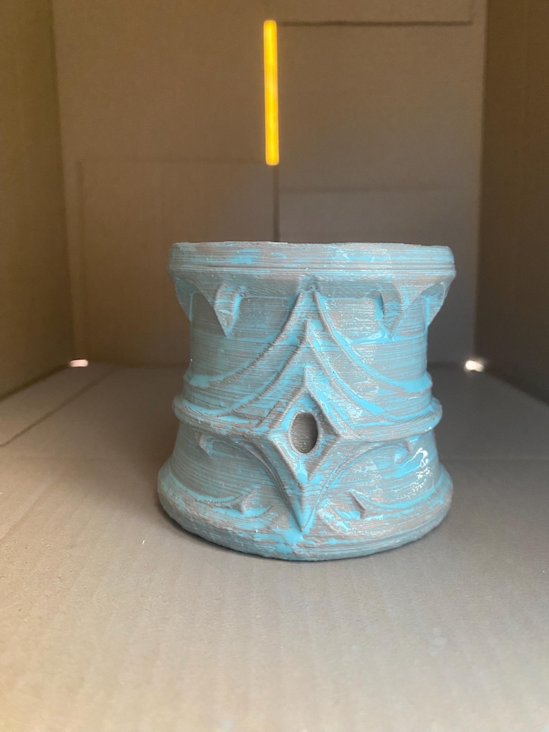 May include: A set of three ceramic mugs with a speckled, matte finish. The mugs are in shades of cream, light gray, and dark gray. Each mug has a simple, minimalist design, perfect for coffee or tea.