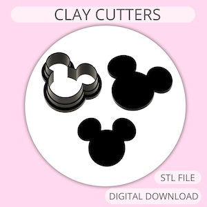 May include: Three black clay cutters in the shape of a mouse head, displayed on a white circular background against a light pink backdrop. The text "CLAY CUTTERS" is at the top. The words "STL FILE" and "DIGITAL DOWNLOAD" are at the bottom.