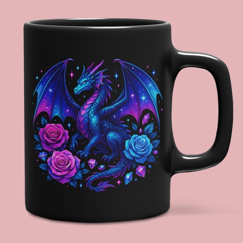 May include: A black ceramic mug featuring a vibrant graphic of a blue and purple dragon with expansive wings. The design includes two pink roses, one blue rose, and several scattered geometric crystals against a dark, starry background.