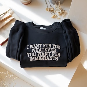 Defend Immigrants Embroidered Sweatshirt: Social Justice Apparel