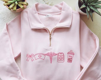 Embroidered Nurse Icon Quarter-Zip Sweatshirt: Healthcare Apparel