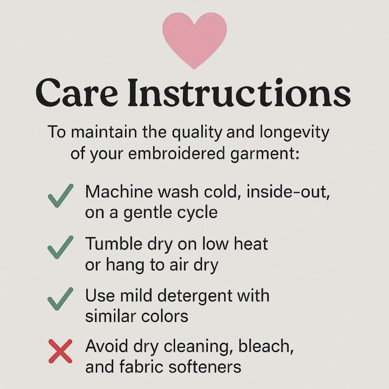 May include: Care instructions for embroidered garments, featuring a pink heart graphic. Text advises washing cold, inside-out, on a gentle cycle, tumble drying on low heat or air drying, and using mild detergent. Avoid dry cleaning, bleach, and fabric softeners.
