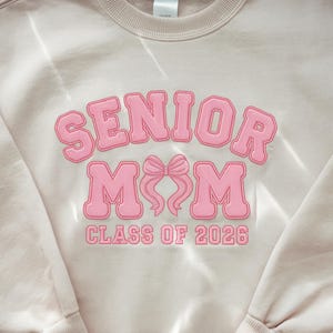 Embroidered Senior Mom 2026 Sweatshirt: Coquette Bow Design