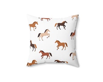 May include: White pillow with a repeating pattern of brown, tan, and white horses running in different directions.