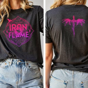 May include: A dark gray t-shirt with a pink and purple graphic design featuring a dragon and the text "Iron Flame".