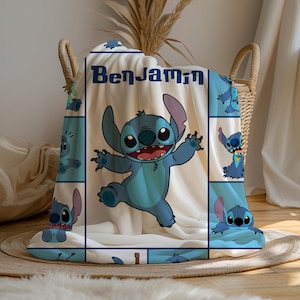 May include: A blue and white blanket featuring the character Stitch from Lilo & Stitch. The blanket has a large central image of Stitch and smaller images around the border. The name "Benjamin" is printed at the top.