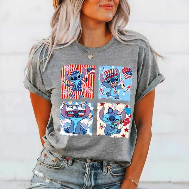 May include: A grey t-shirt with a four-panel design of the character Stitch in patriotic attire. Each panel shows Stitch with American flag-themed accessories, including a hat, sunglasses, and holding a flag and ice cream.