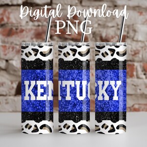 Peut inclure: Trois gobelets en acier inoxydable avec un fond de paillettes bleues et un texte blanc qui dit "Kentucky". Les gobelets sont décorés d'un motif léopard noir et blanc.