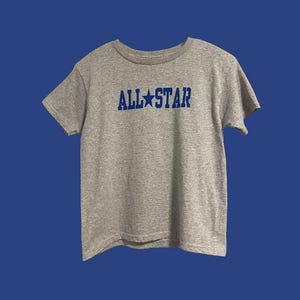women&#39;s baby tee with aesthetic, trendy, relatable design.