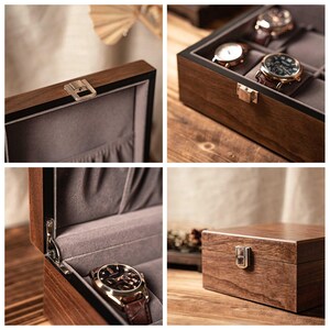 Puede incluir: Una caja de madera de color marr&oacute;n oscuro para guardar relojes, con un cierre de metal plateado, tapa con bisagras y un forro interior de tela gris suave. La caja incluye varios compartimentos para relojes y bisagras met&aacute;licas visibles.