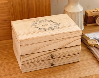 May include: A wooden jewellery box with three drawers. The top drawer has a floral design and the name "Celeste" engraved on it.