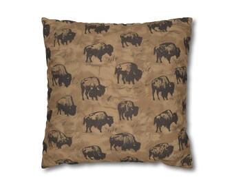 May include: Square throw pillow with a repeating pattern of dark brown bison silhouettes on a tan background. The pillow has a soft, textured appearance, suitable for home decor.