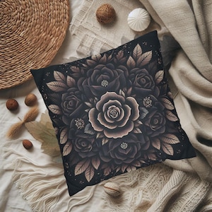 May include: Black throw pillow with a floral design featuring a bouquet of dark roses with light brown outlines. The roses are arranged in a circular pattern with leaves and stems.