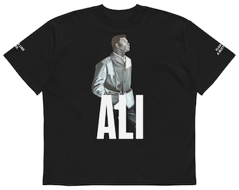 May include: Black t-shirt featuring a portrait of a man in a suit with the word "ALI" in large white letters. The shirt has text on the sleeves, including "Float like a butterfly" and "Sting like a bee."
