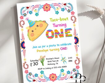 May include: A white invitation card with a colorful floral border. The card features a cartoon taco wearing a party hat and the text "Taco-bout Turning ONE". Details include the date, time, and RSVP information for a birthday fiesta.