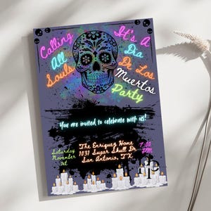 May include: A Dia De Los Muertos party invitation with a sugar skull design. The invitation features the text "Calling All Souls" and "It's a Dia De Los Muertos Party" in neon colours. Additional text includes event details and a candle border.