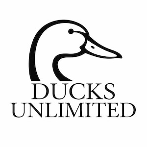 May include: Black and white logo featuring a duck head profile. The duck's head is outlined in black, with a detailed beak and eye. Below the duck head, the words "DUCKS UNLIMITED" are printed in a bold, sans-serif font.
