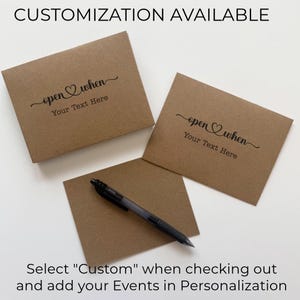 May include: Three brown paper envelopes with the text "open when" and "Your Text Here" in black script. A black pen rests on a fourth envelope. The text "CUSTOMIZATION AVAILABLE" and instructions are also visible.