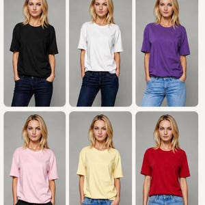 May include: A collection of six short-sleeved crew neck t-shirts in black, white, purple, light pink, pale yellow, and red. Each shirt is displayed on a figure wearing blue jeans or black trousers, presented as a T-Shirt Pack for product listings.