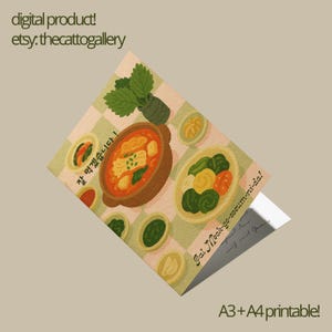 May include: A digital product featuring a colorful illustration of a Korean meal, including a stew and side dishes, on a checkered background. Text includes "digital product! etsy.thecattogallery" and Korean text. The product is A3+A4 printable.
