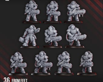 May include: Ten grey miniature models of armoured figures, each holding a large weapon, are displayed on black bases. The text "36 mm from feet to eyes" is visible. The DakkaDakka.Store logo is in the top left corner.