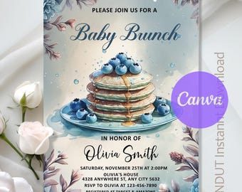 May include: Baby brunch invitation featuring a stack of pancakes topped with blueberries and syrup. The invitation includes the text "Baby Brunch" and details for Olivia Smith's baby brunch, including the date, time, and location.