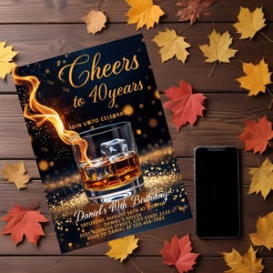 May include: A birthday invitation with the text "Cheers to 40 years" and "Daniel's 40th Birthday" is displayed. The invitation features a whiskey glass with ice cubes and a flame graphic. A smartphone and autumn leaves are also present.