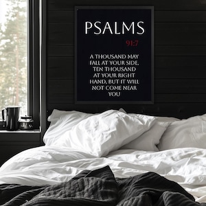 May include: A black and white framed print with the text "PSALMS 91:7" and the verse "A thousand may fall at your side, ten thousand at your right hand, but it will not come near you".