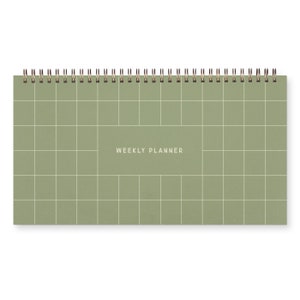A green spiral bound weekly planner with a grid design on cover