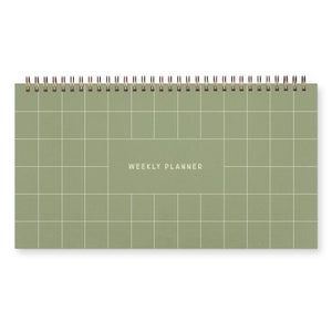 A green spiral bound weekly planner with a grid design on cover