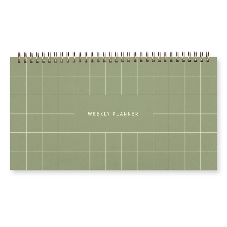 A green spiral bound weekly planner with a grid design on cover